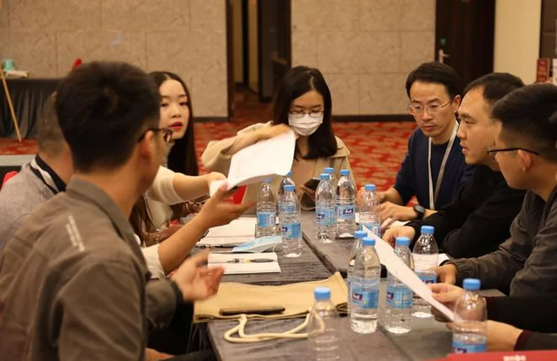 Project order communication meeting with documents and buyer discussion